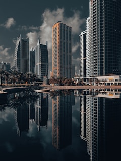 A city with tall buildings and a body of water