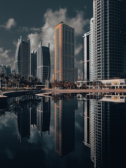 A city with tall buildings and a body of water