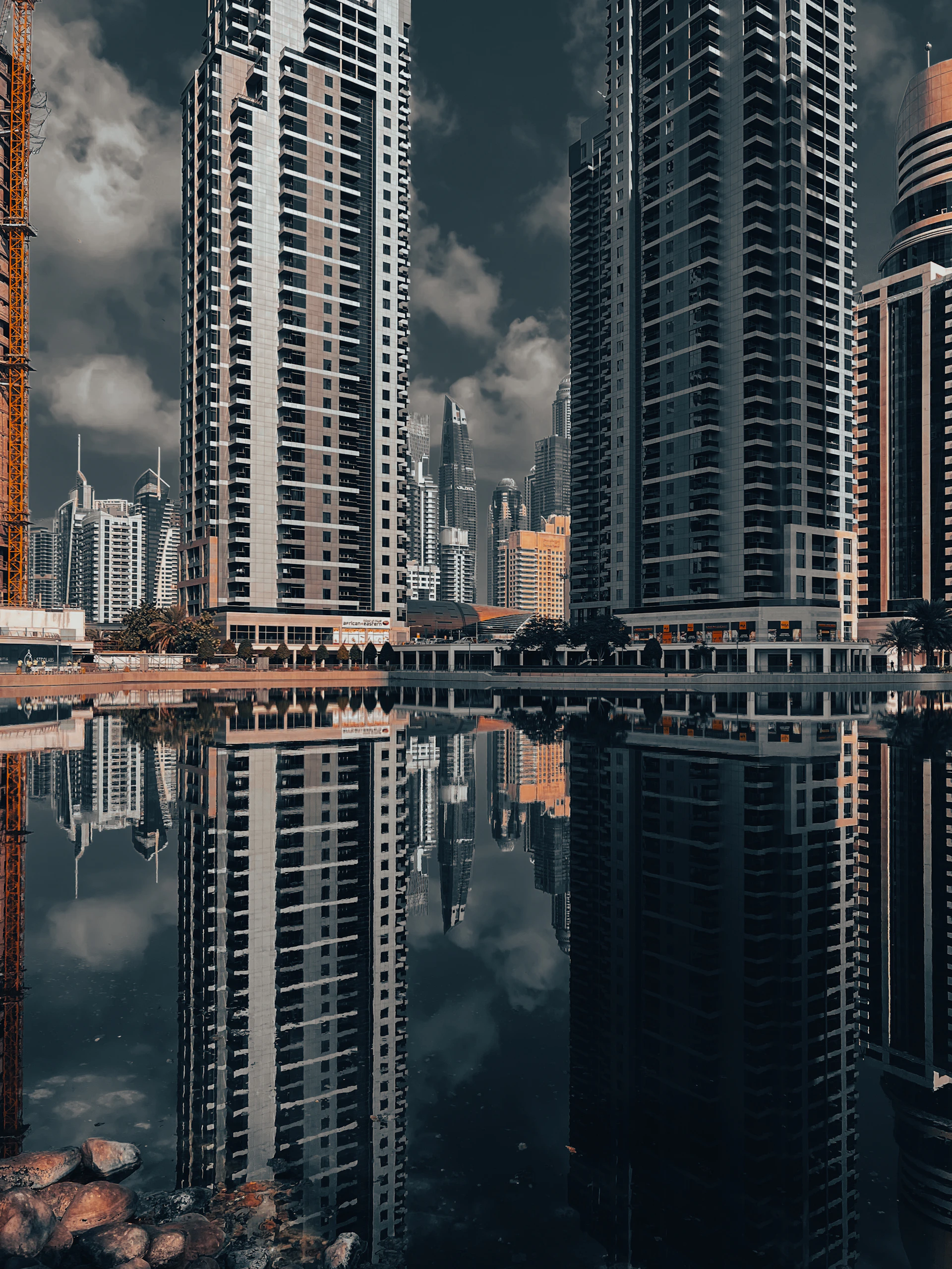 A city with tall buildings and a body of water