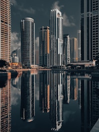 A city with tall buildings and a body of water