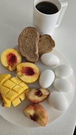 A white plate topped with different types of food