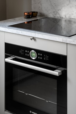A black and white oven in a kitchen