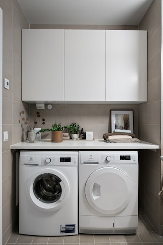 A laundry room with a washer and dryer