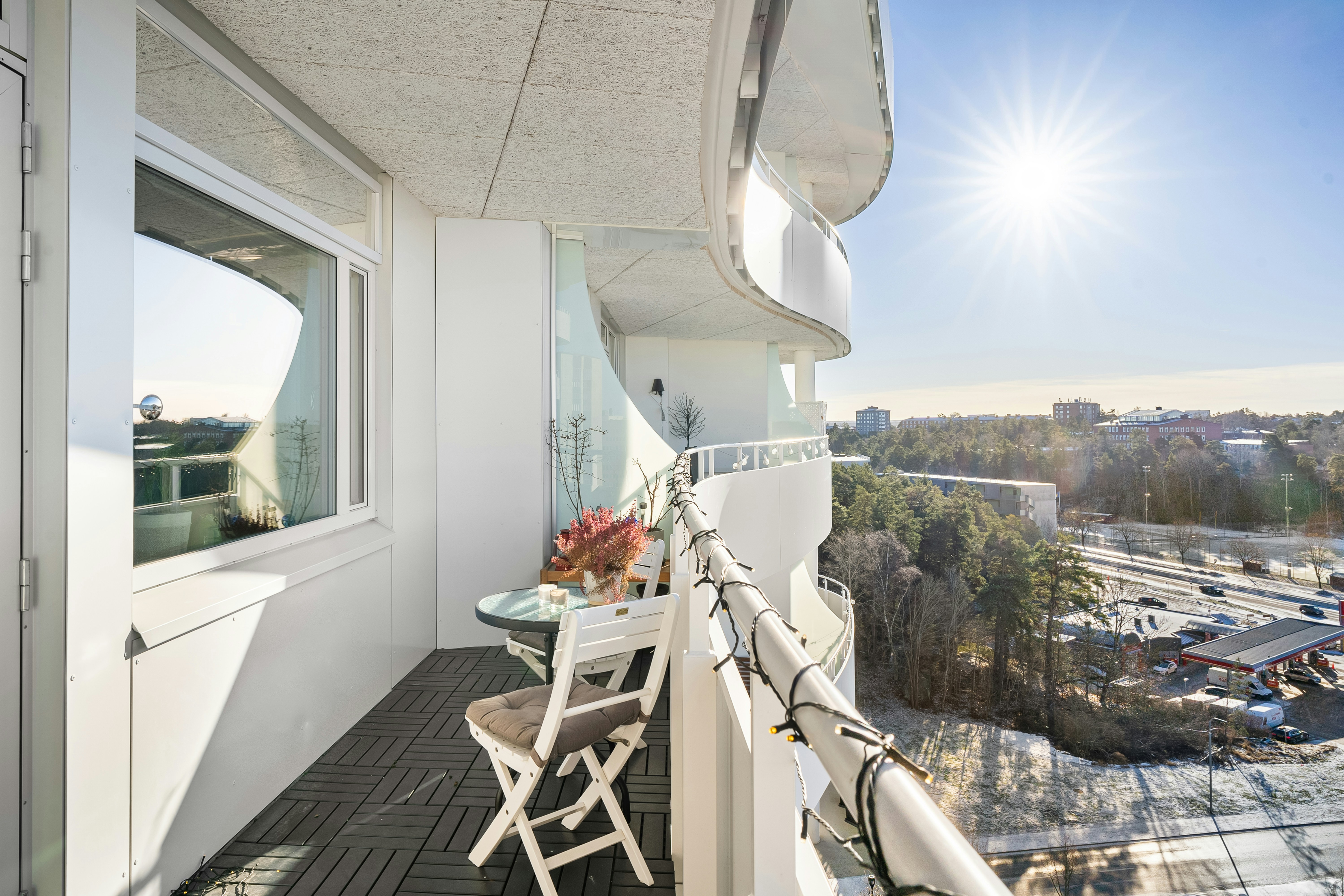 A spacious, furnished full balcony on a sunny day with city views. - apartments for rent in chicago with balconies