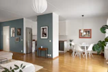A living room filled with furniture and a dining room table