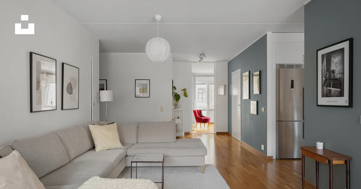 A living room filled with furniture and a hard wood floor photo – Free ...