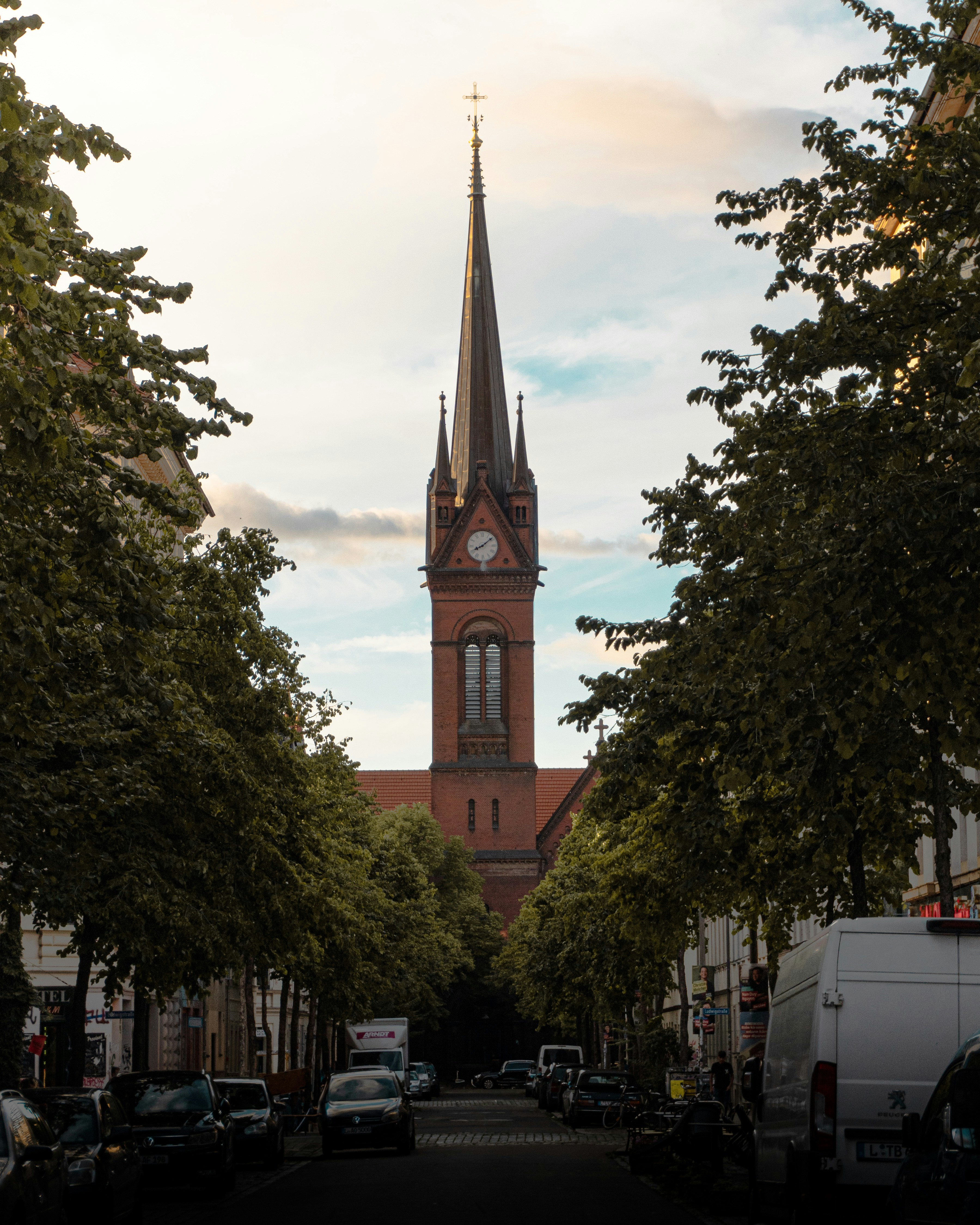 A church steeple towering over a city street