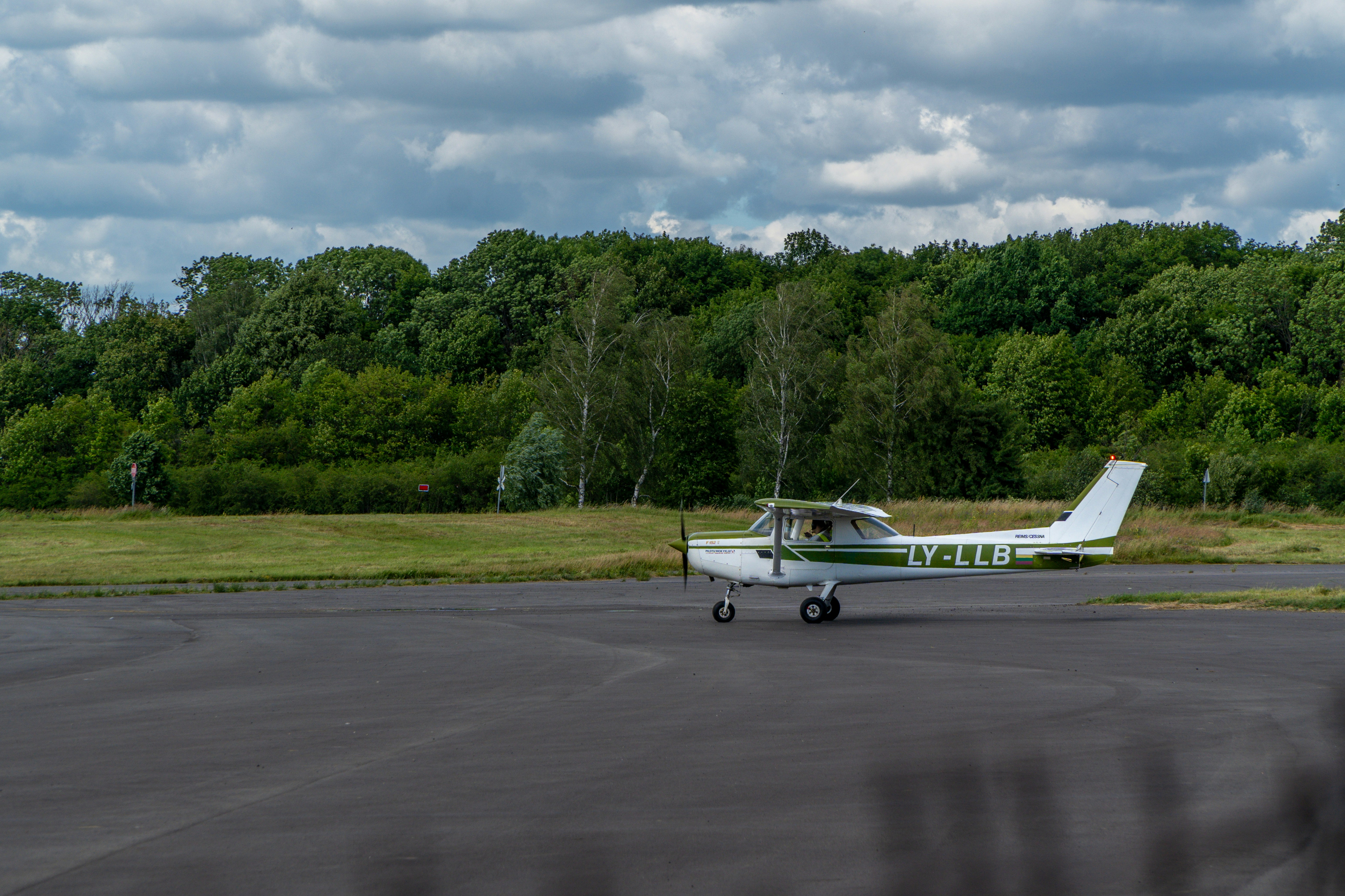 A small plane sitting on top of an airport tarmac