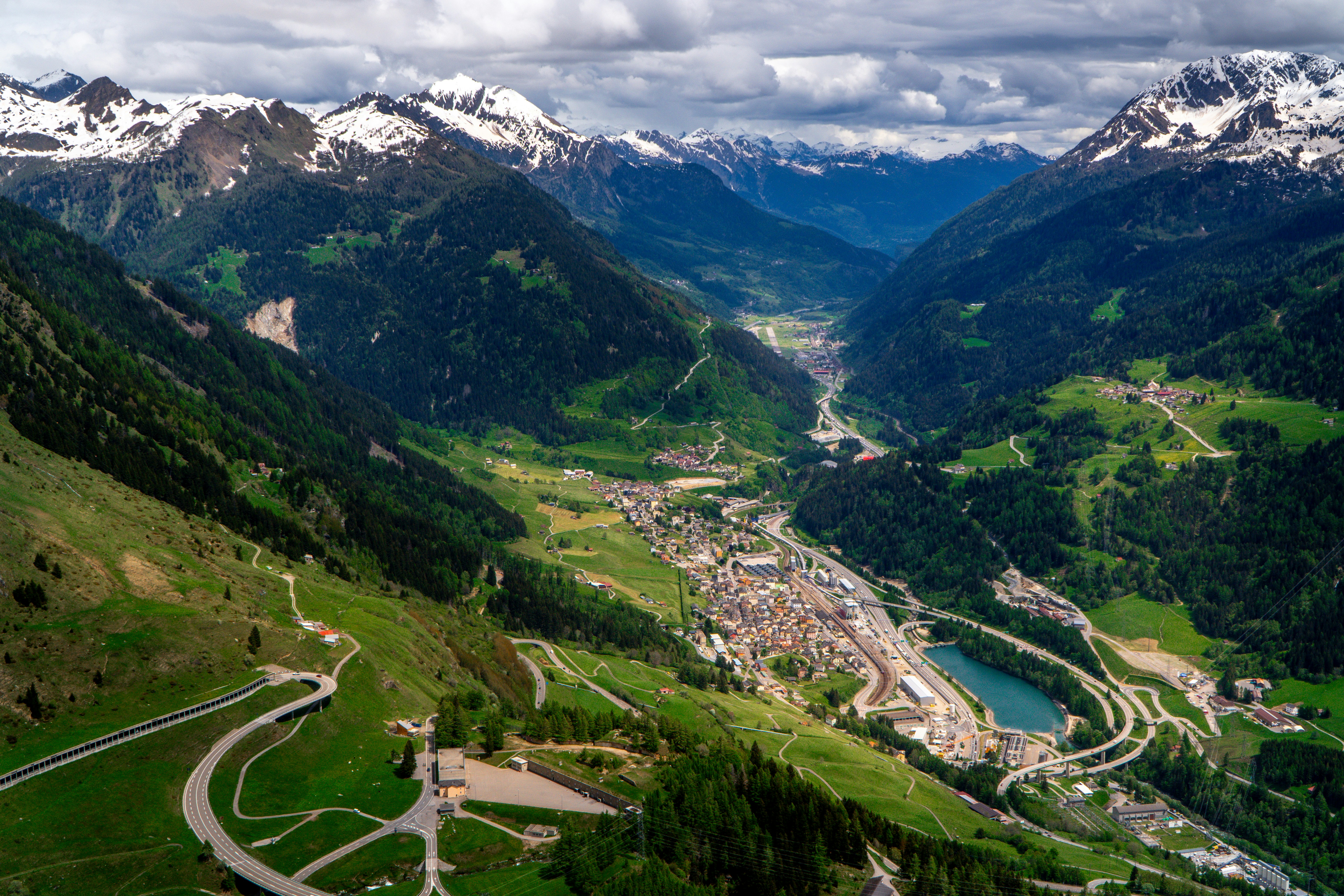 A scenic view of a valley with mountains in the background