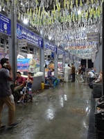 A group of people standing around a store
