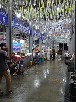 A group of people standing around a store