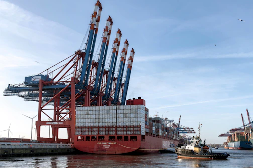A large red and white boat in the water