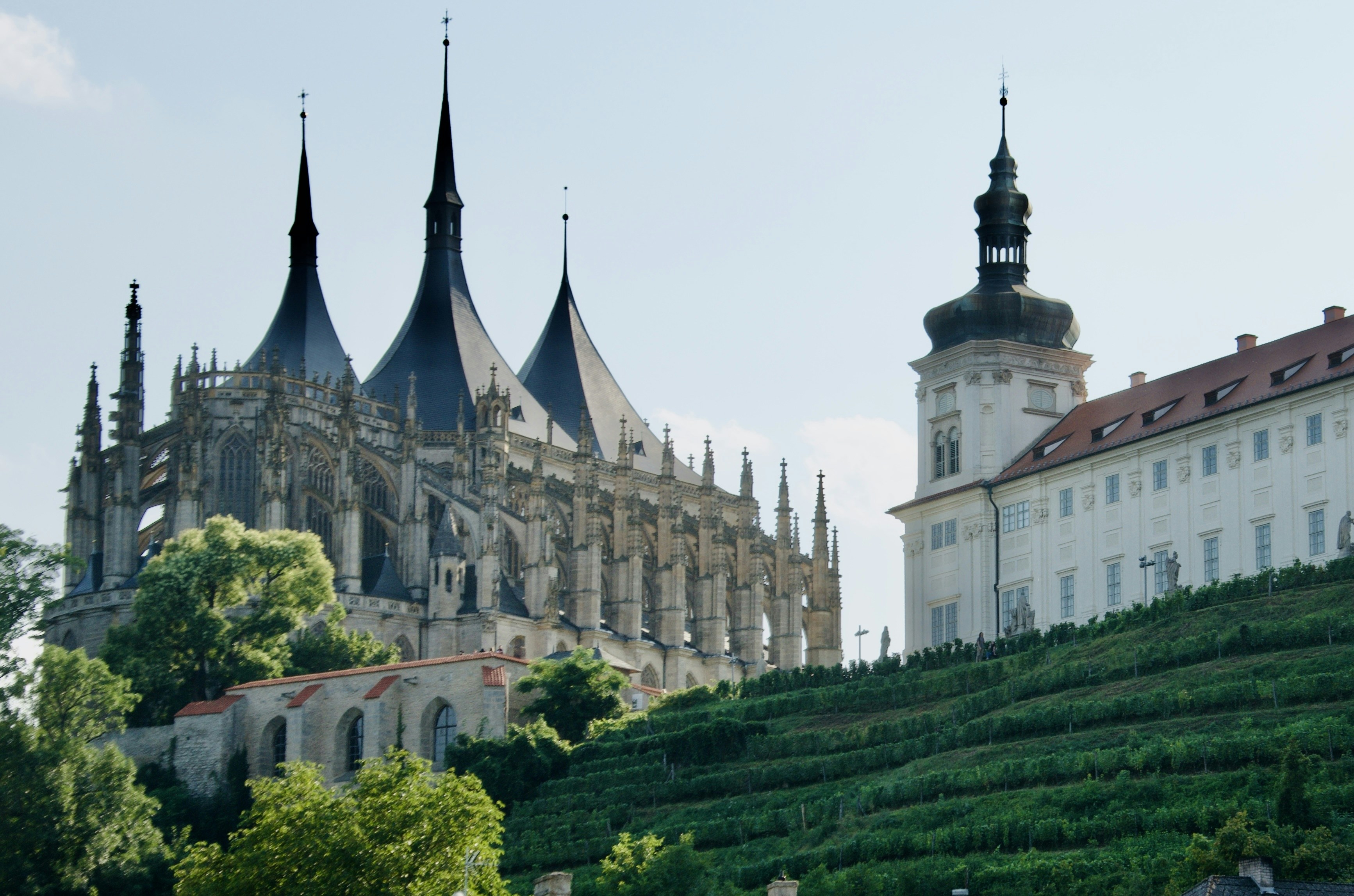 A large building with towers on top of a hill