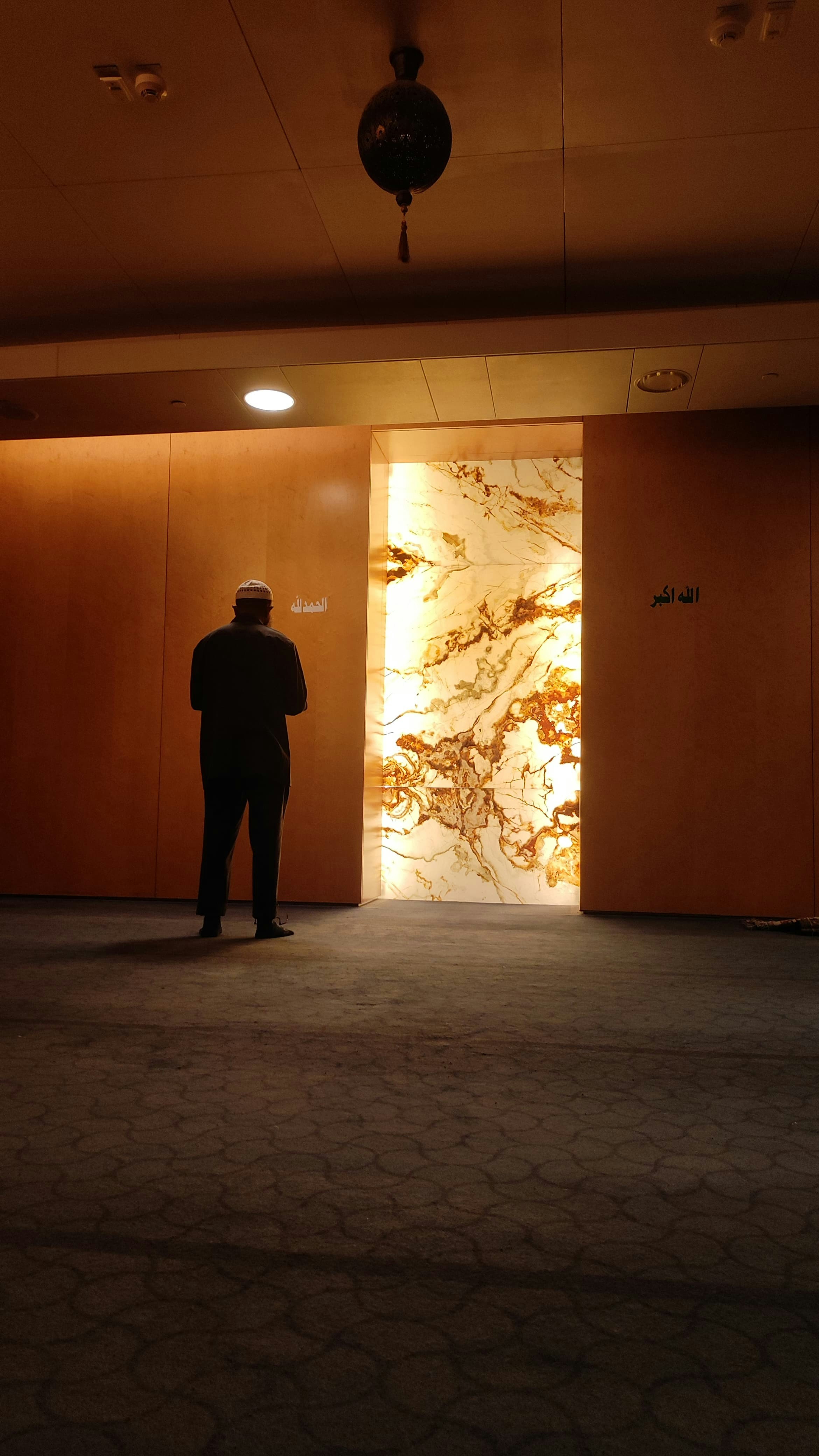 A man in a suit standing in a room