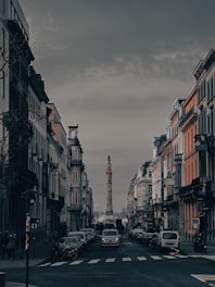 A city street with cars parked on both sides of it