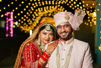 A bride and groom posing for a picture