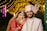 A bride and groom posing for a picture