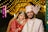 A bride and groom posing for a picture