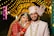 A bride and groom posing for a picture
