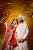 A bride and groom posing for a picture