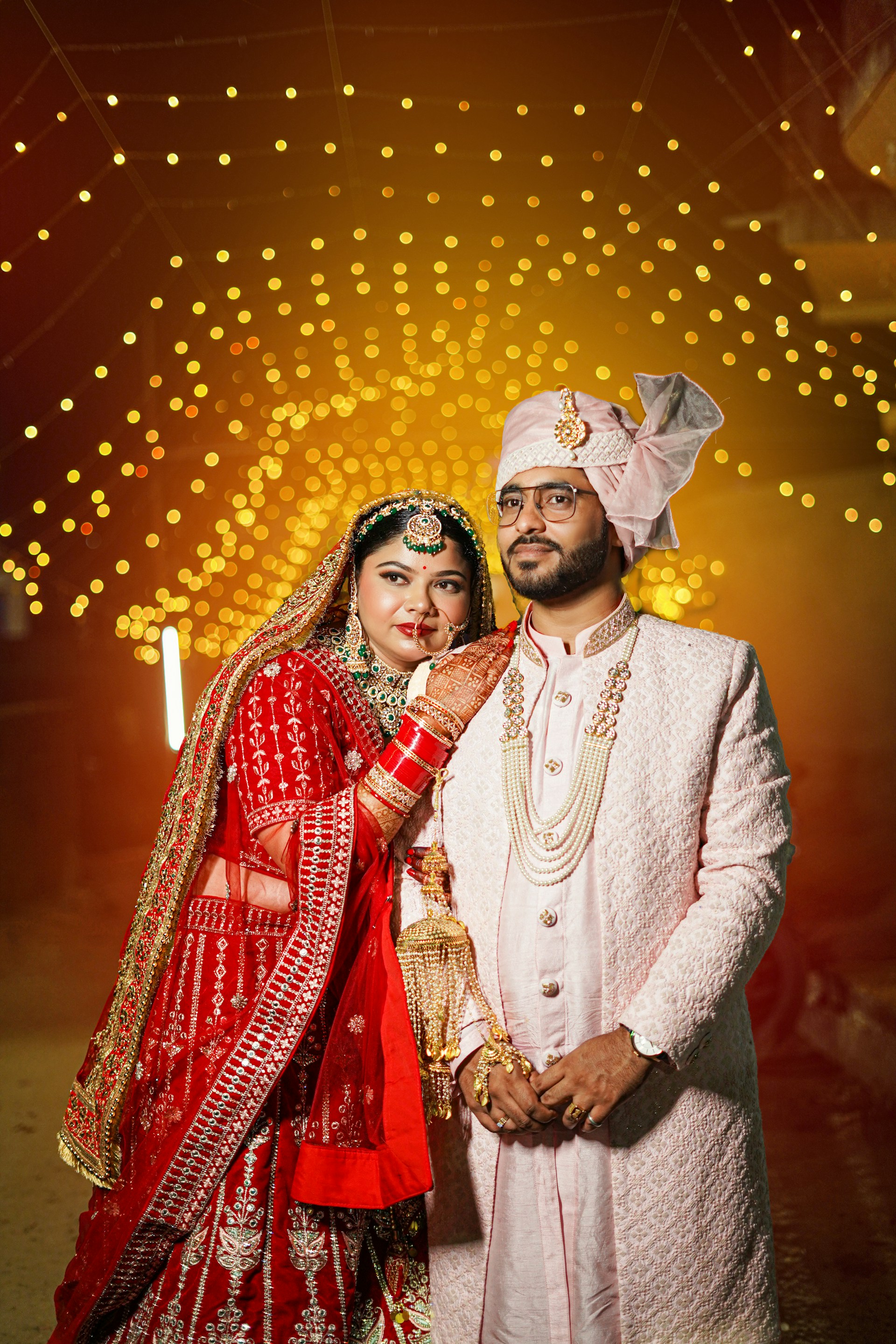A bride and groom posing for a picture