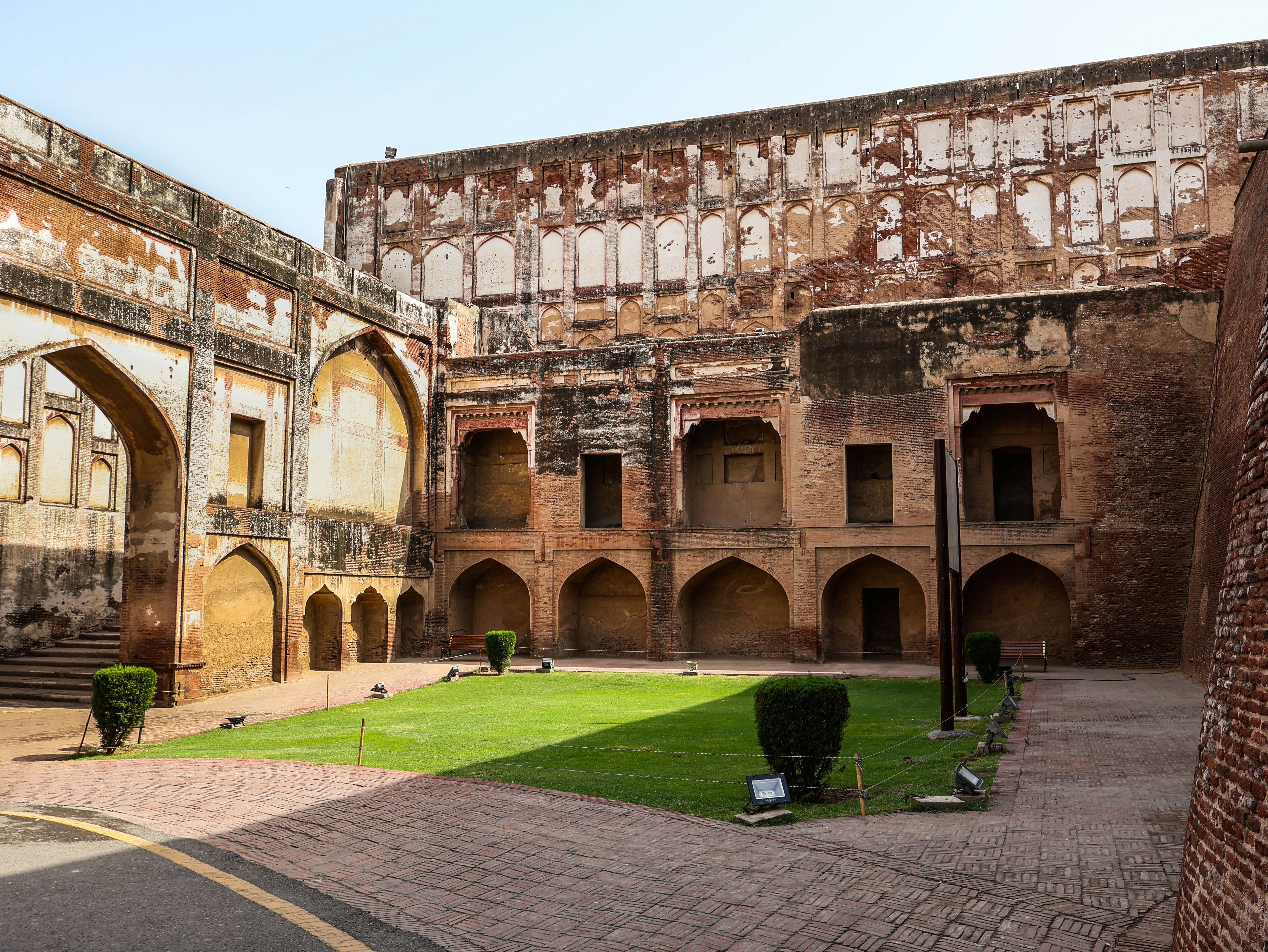 Immerse yourself in centuries of history at the majestic Lahore Fort, a UNESCO World Heritage site. This iconic Mughal masterpiece boasts intricate architecture, sprawling courtyards, and opulent palaces. Explore the remnants of a bygone era as you wander through its grand gates and marvel at the stunning craftsmanship. From the towering Alamgiri Gate to the serene Shish Mahal, every corner tells a story of power, culture, and elegance.