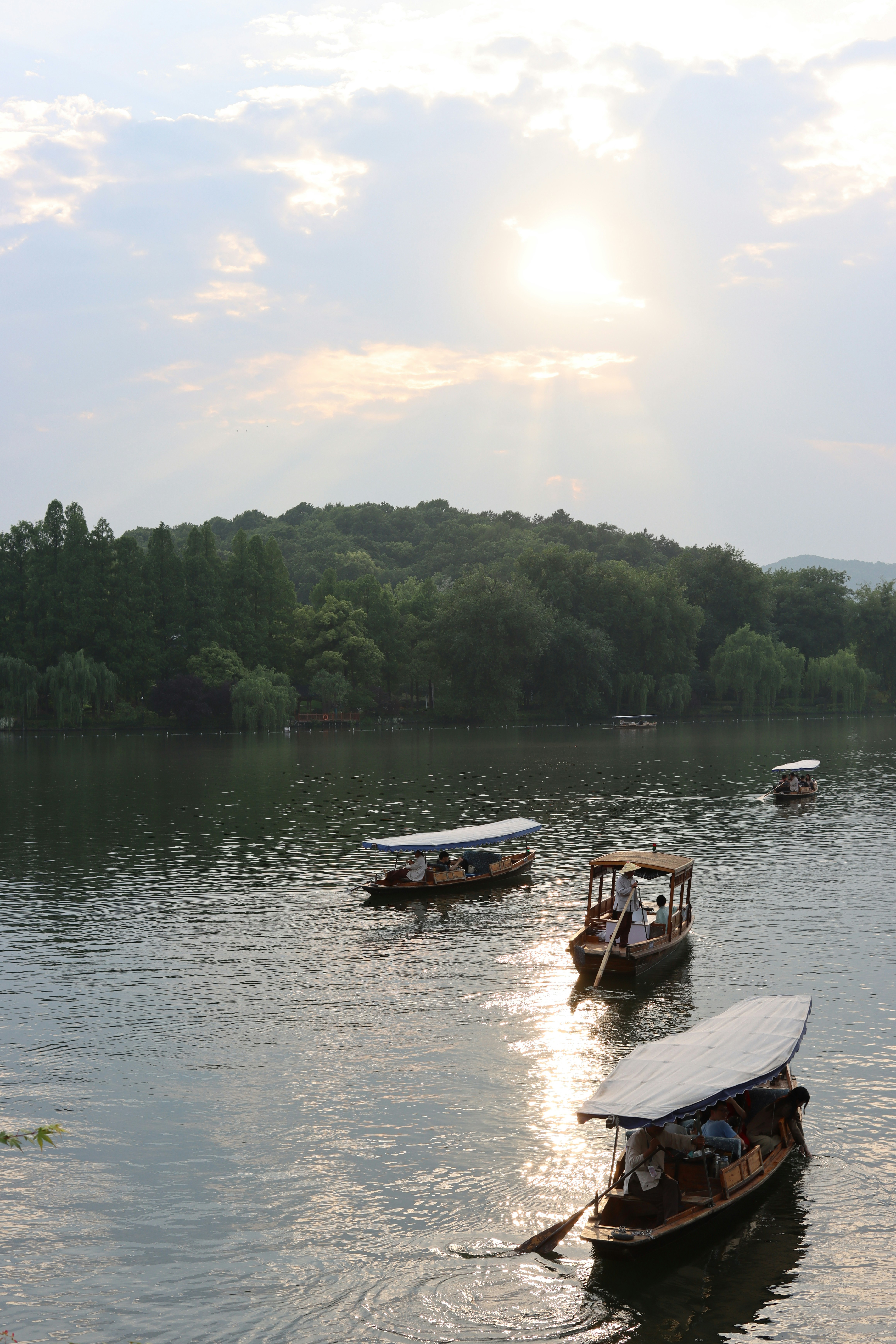 A group of boats floating on top of a lake