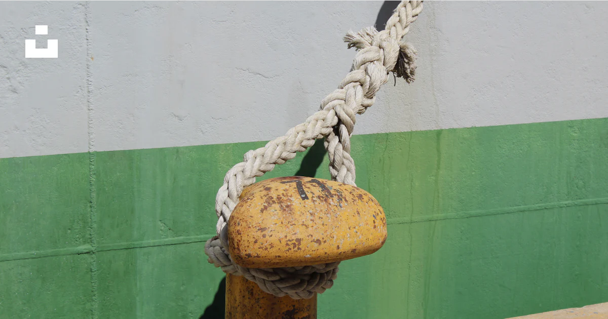Fire Hydrant Rope A yellow fire hydrant with a rope attached to it photo – Free Greece ...
