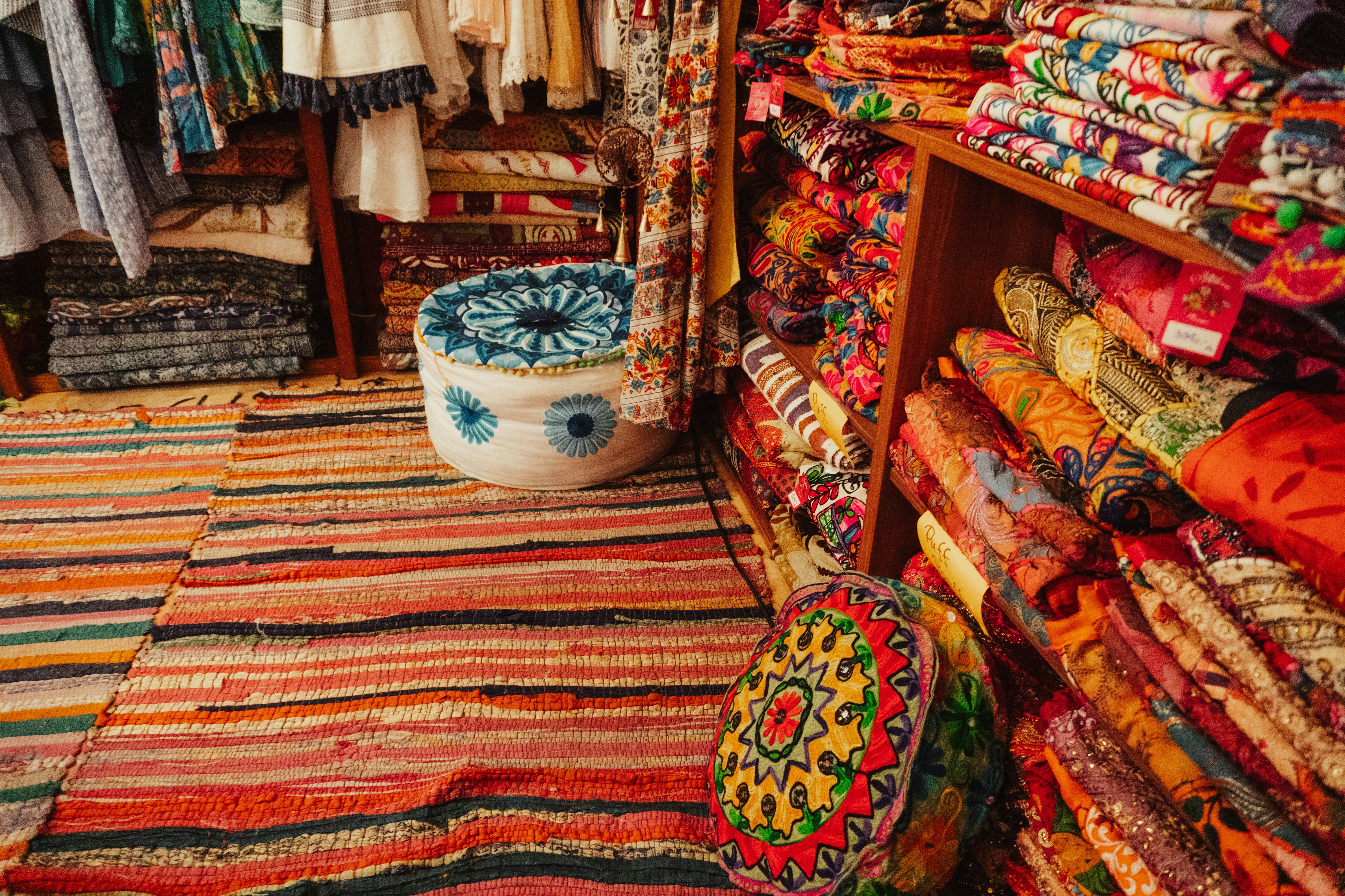 A room filled with lots of colorful rugs