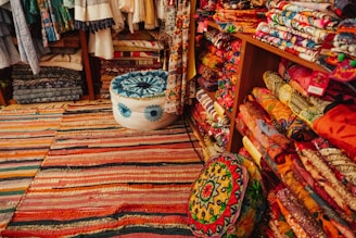 A room filled with lots of colorful rugs