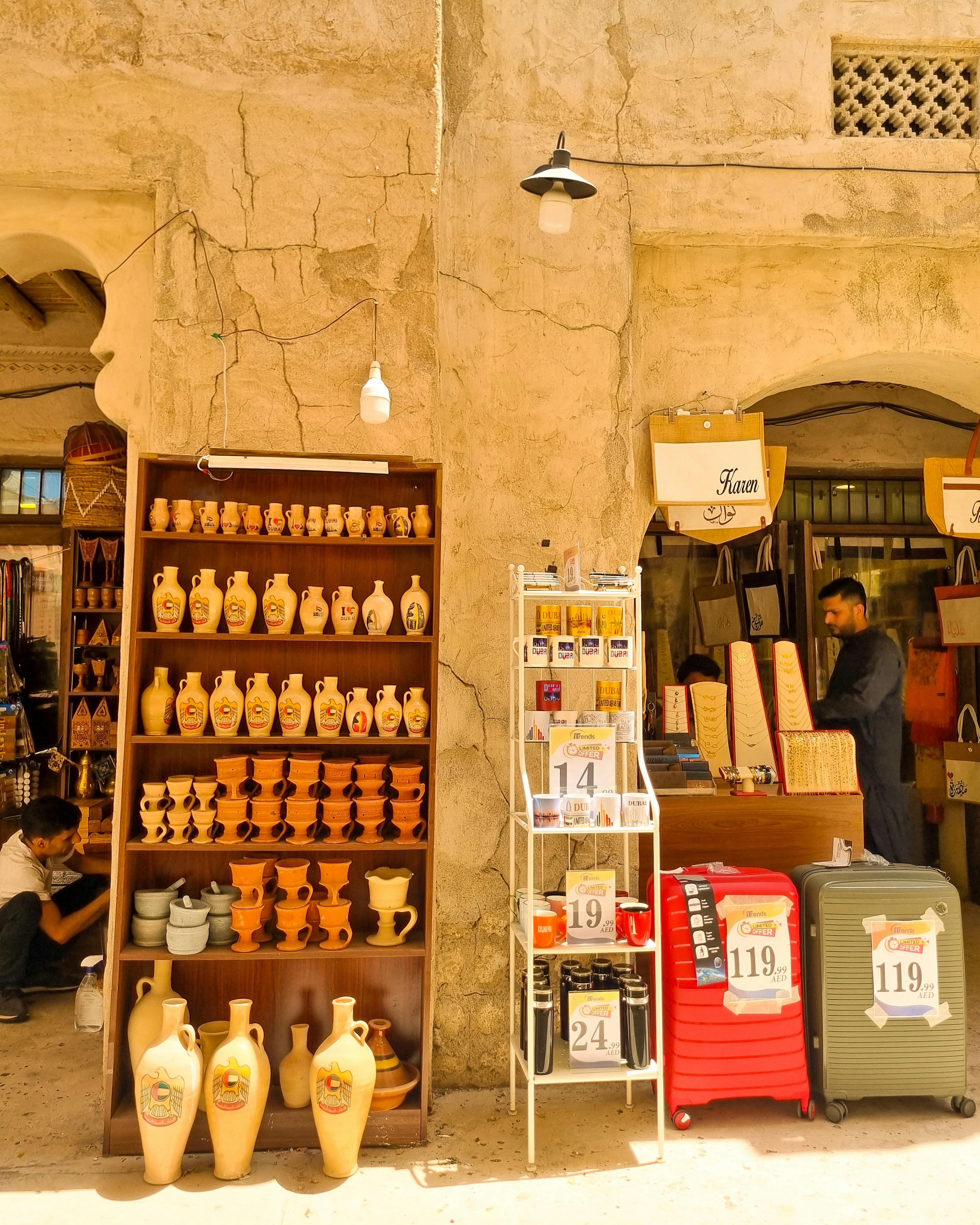 A man sitting on a chair in front of a store