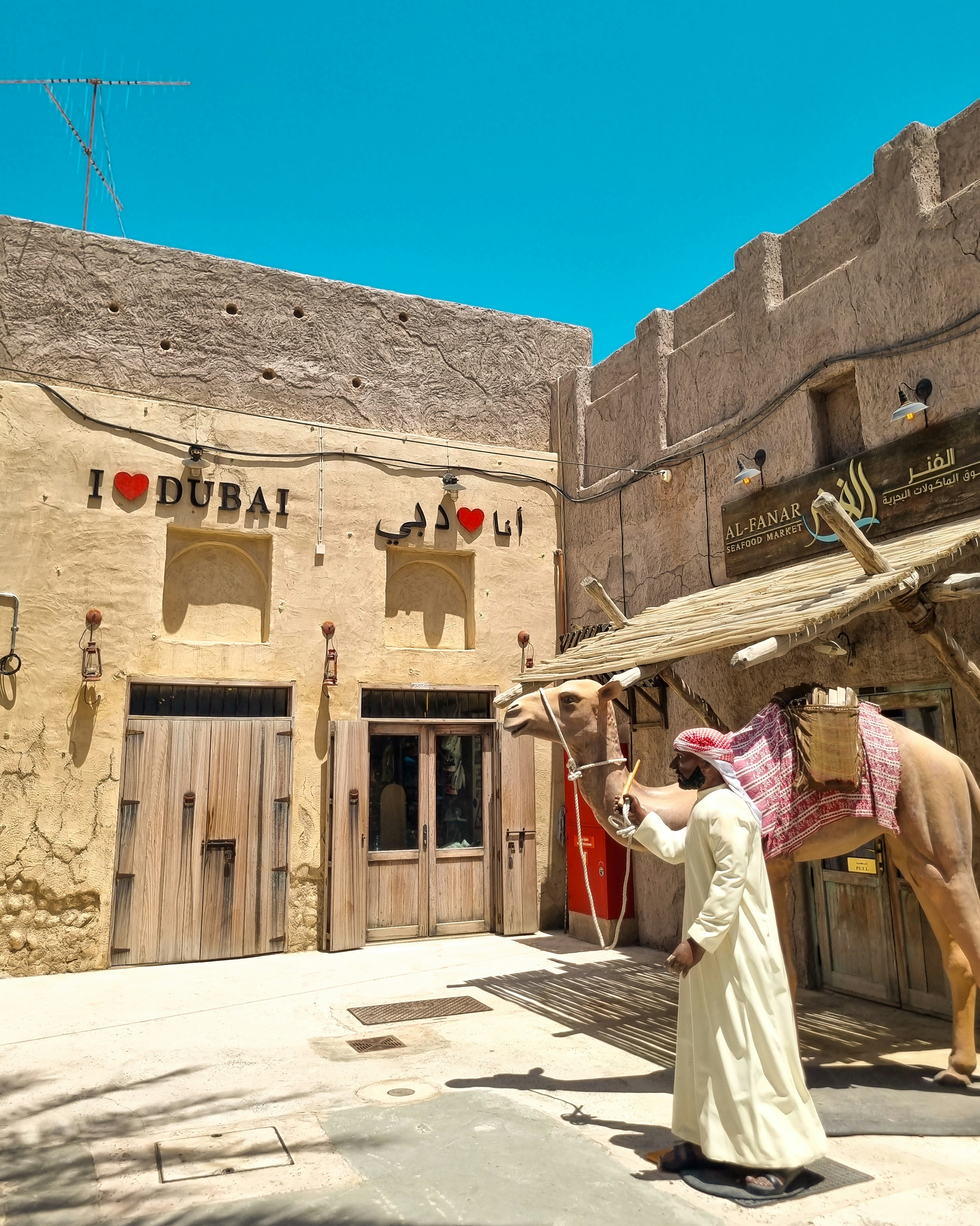 A woman standing in front of a horse statue