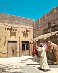 A woman standing in front of a horse statue