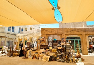 A group of items sitting under a yellow umbrella