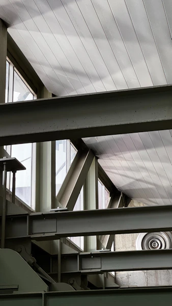 A metal structure with a clock on top of it