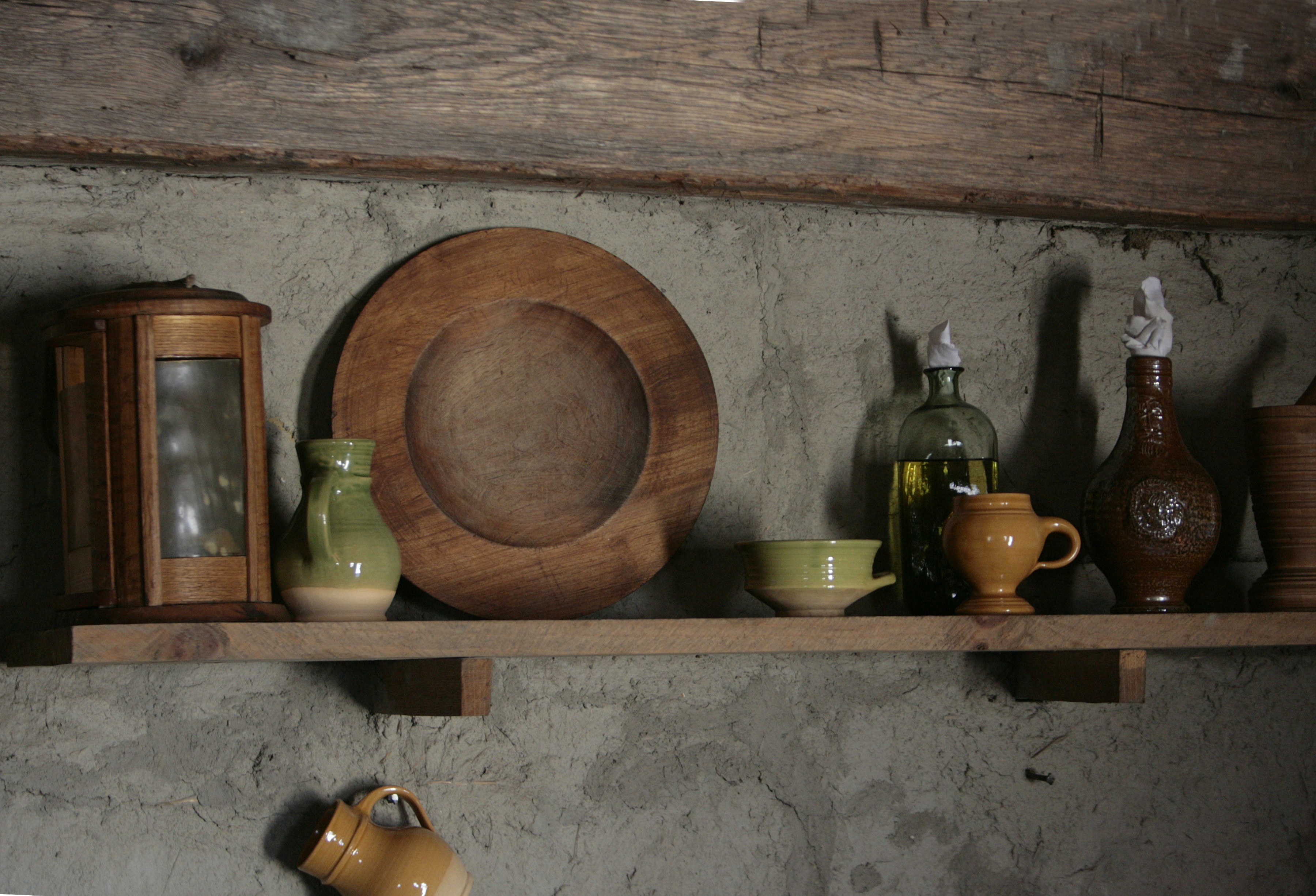Rustic wooden wall shelf with metal brackets for home organization and display