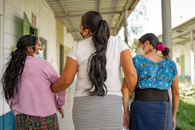 A group of women standing next to each other