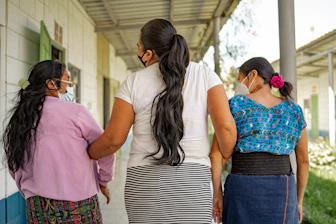 A group of women standing next to each other