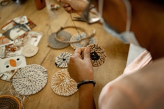 A woman is working on a piece of art