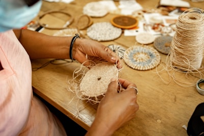 A woman is working on a piece of art