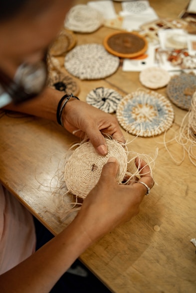 A person working on a piece of art on a table