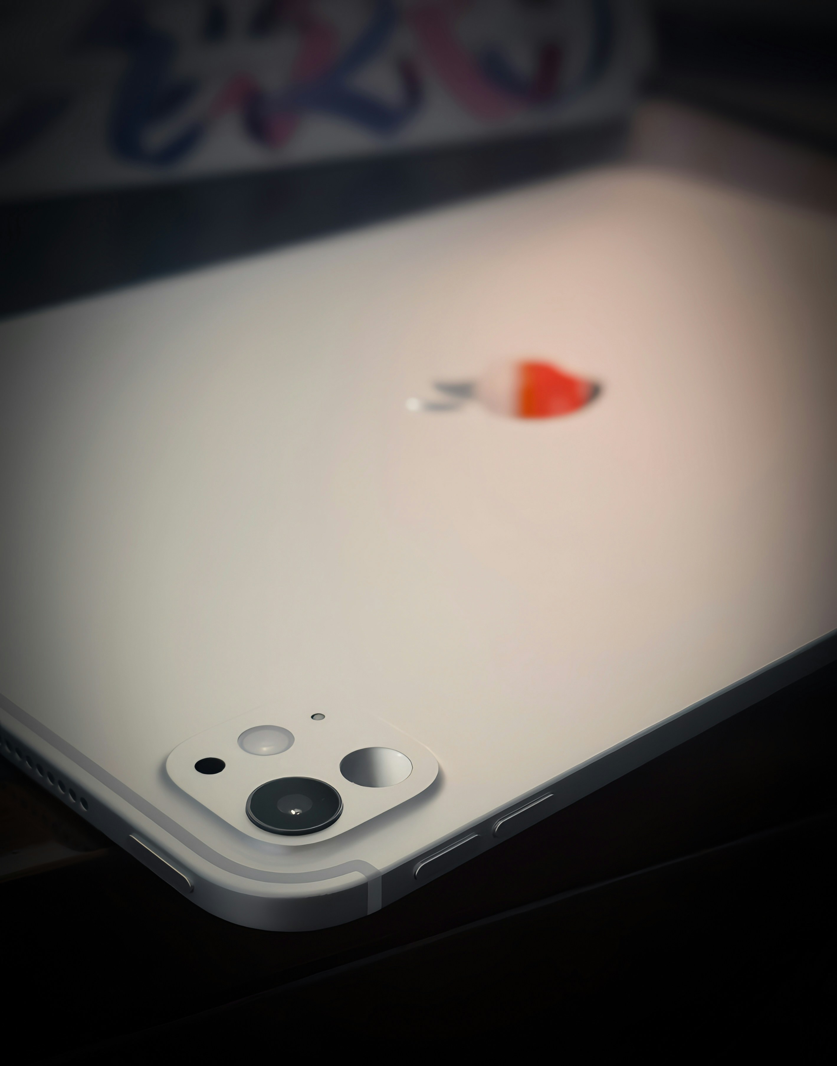 A close up of an apple laptop on a desk