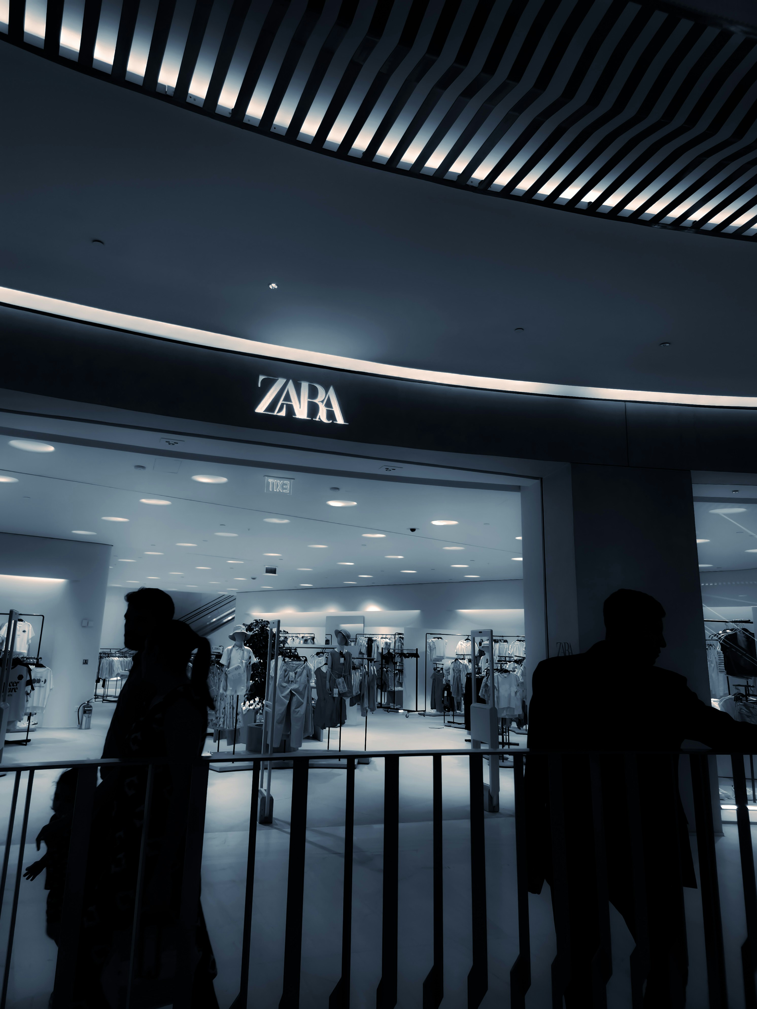 A group of people standing in front of a building