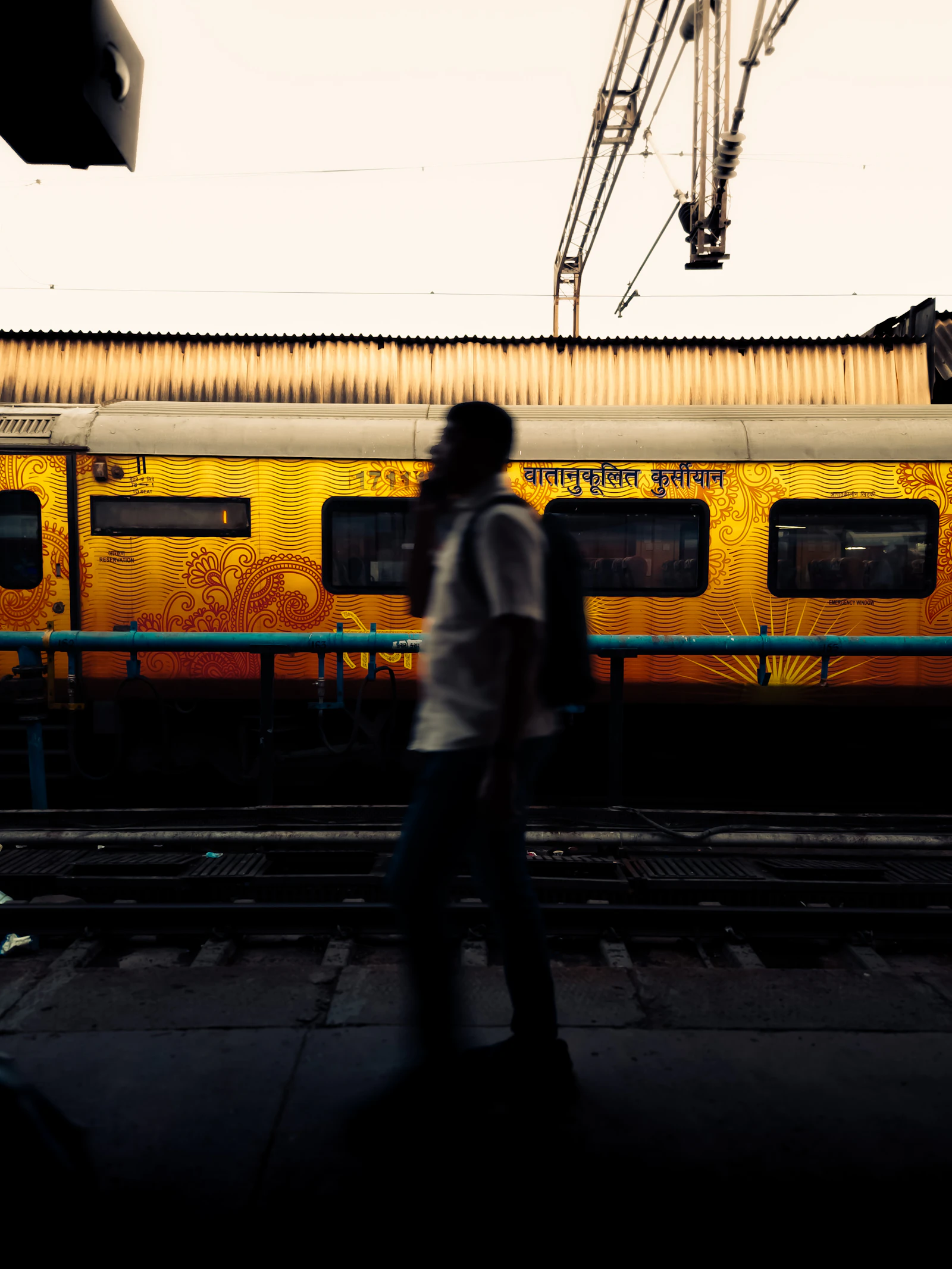 Railway worker standing beside a train on the network