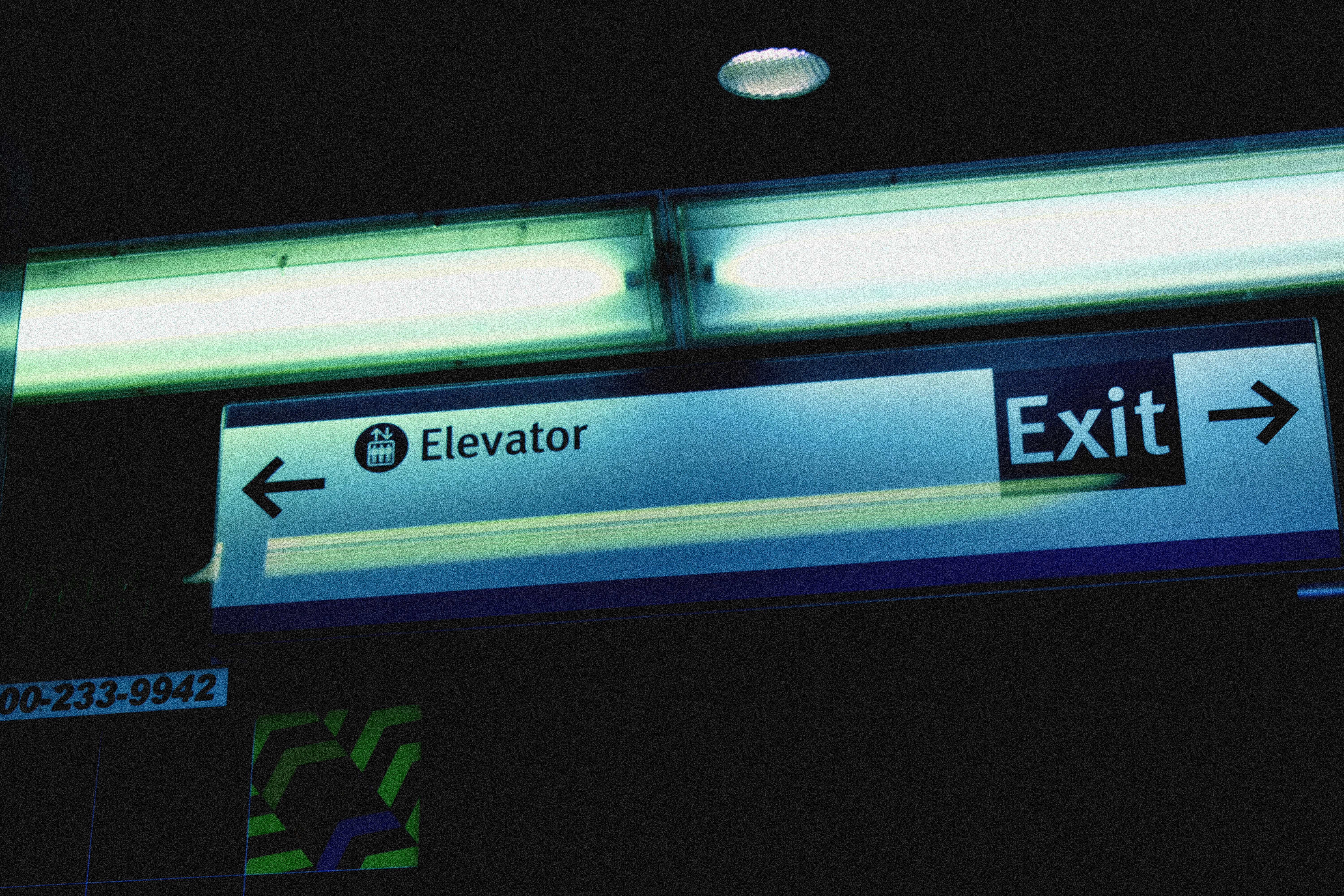 An exit sign is lit up at night