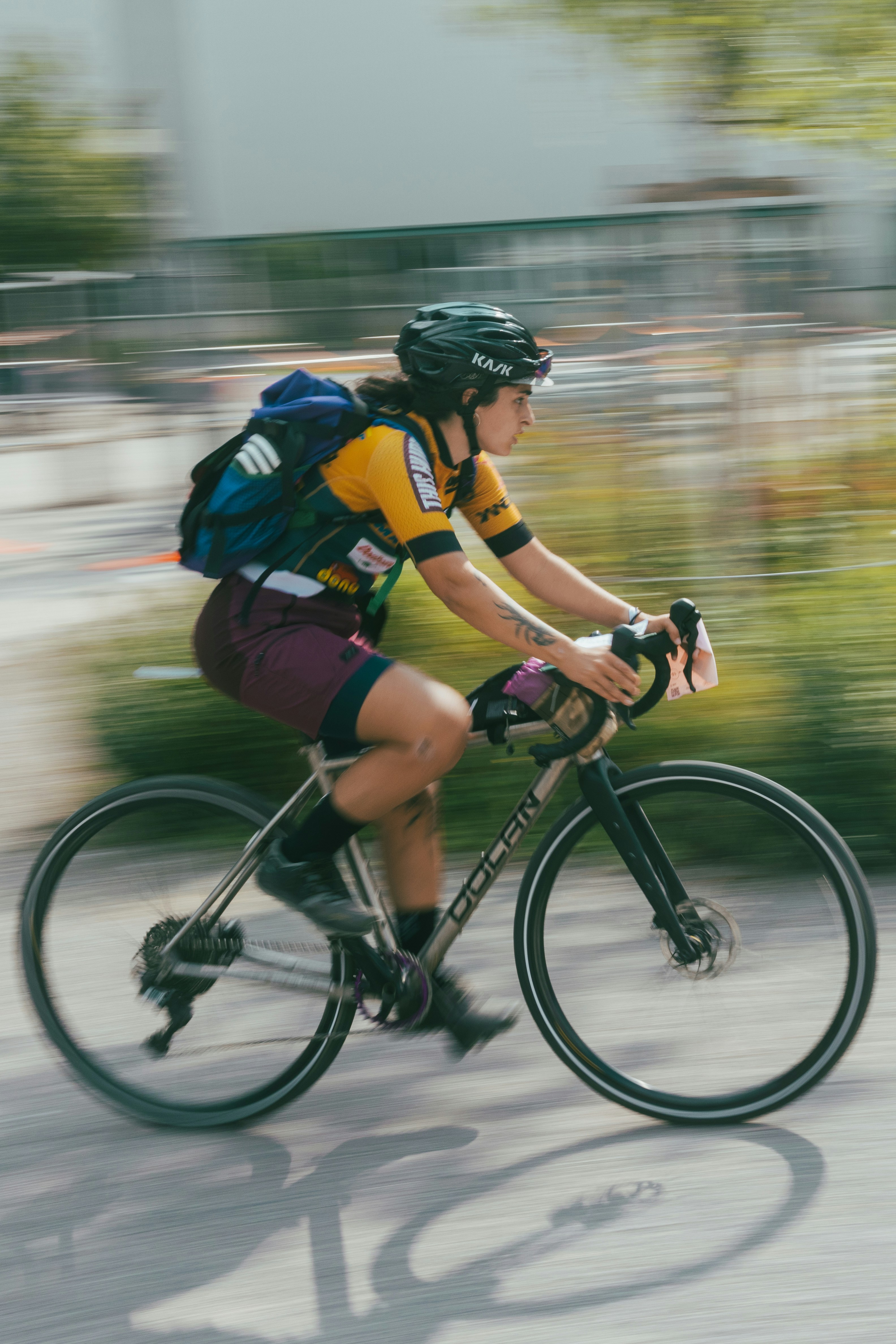 A man riding a bike down a street