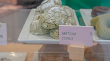 A display case filled with lots of different types of pastries