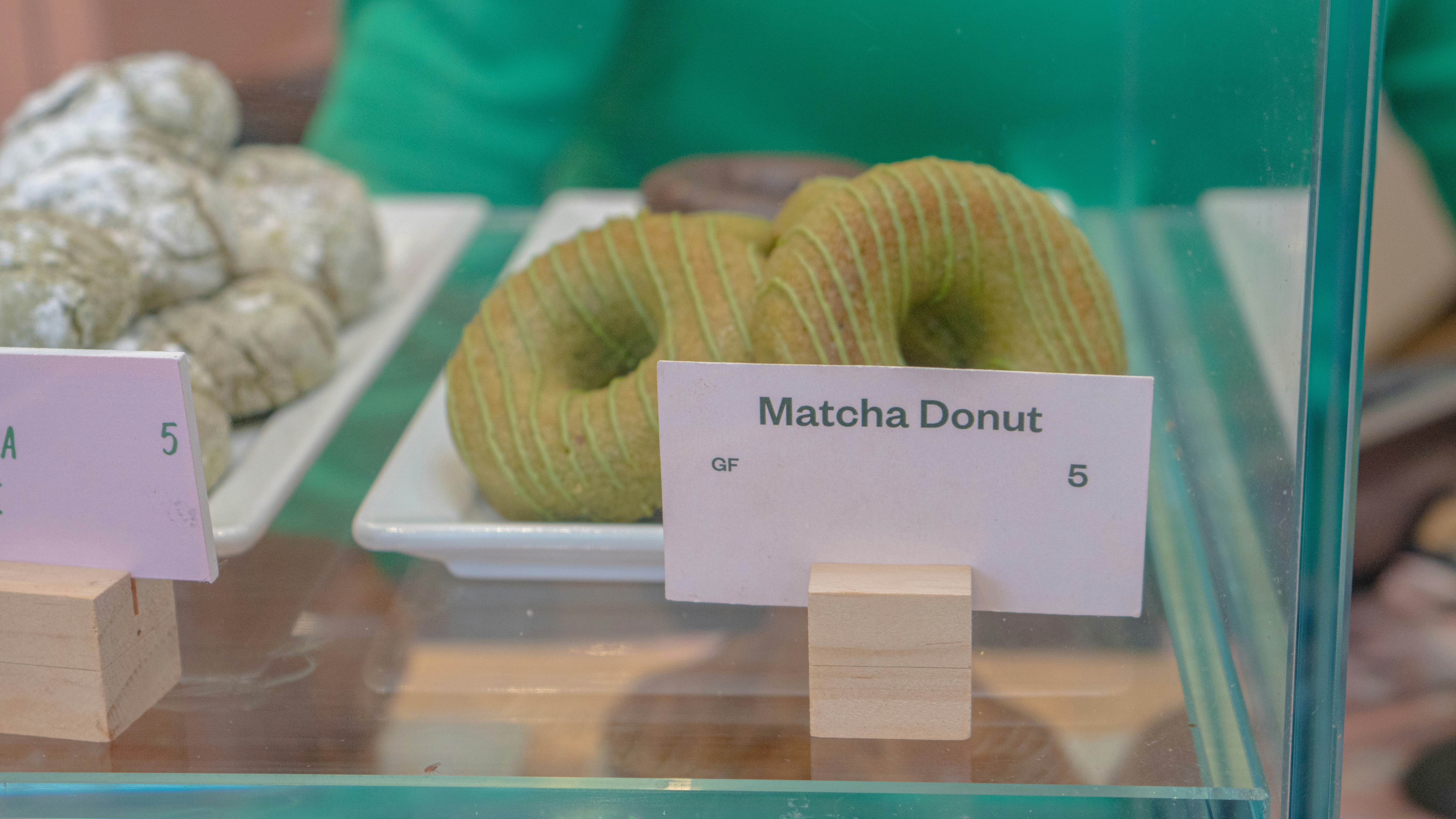 A display case filled with different types of doughnuts