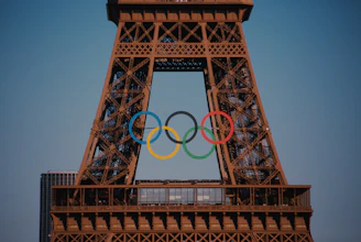 The eiffel tower with the olympic rings in front of it