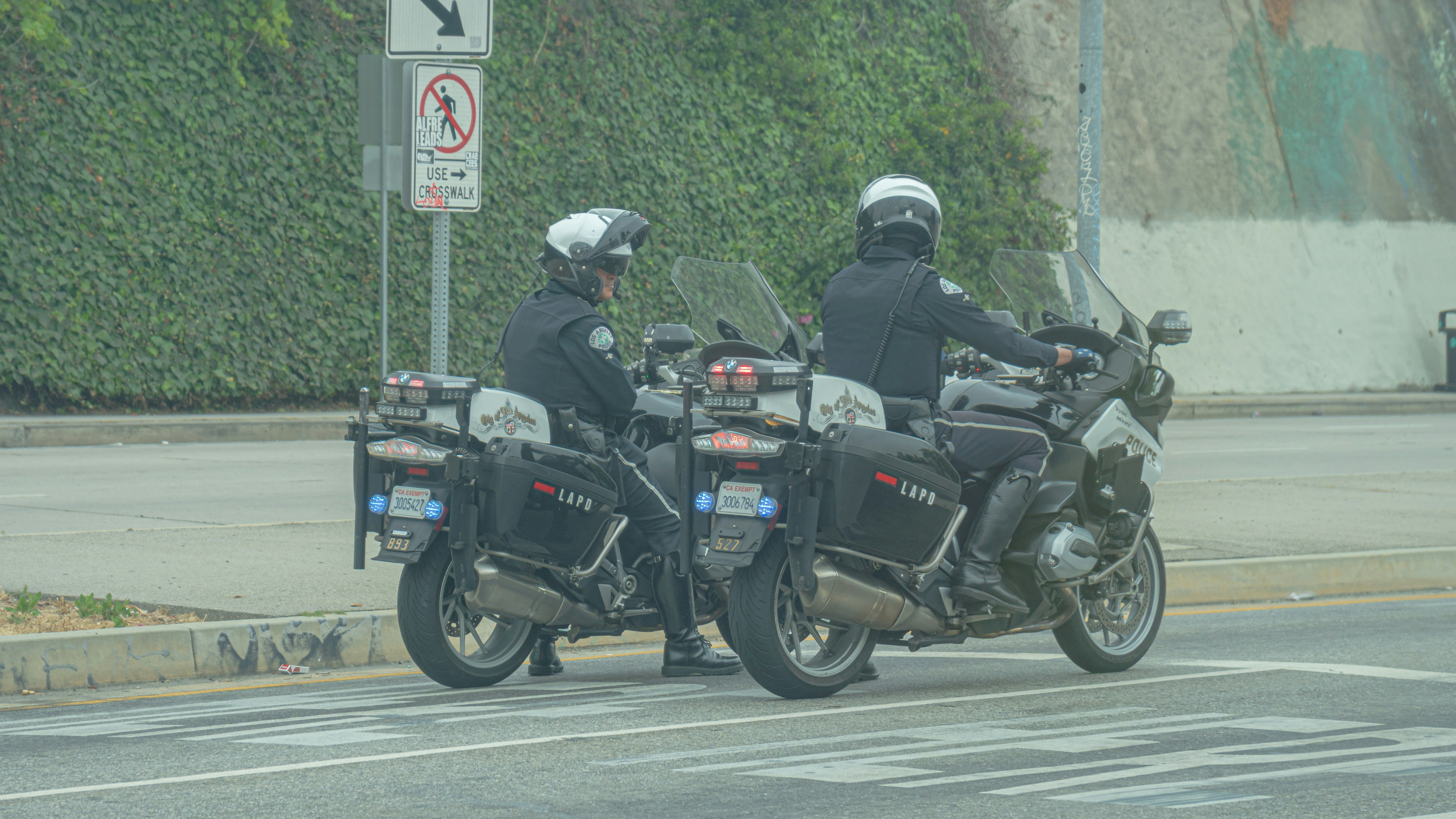Two police officers on motorcycles on a city street